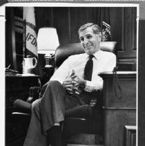 Seated is California Governor, George Deukmejian