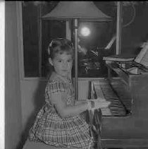 Girl playing a piano