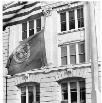 Mayor Richard H. Marriott and unidentified woman raising United States and United Nations flags at City Hall