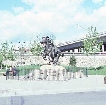 Old Sacramento. View of the Pony Express Statue site at 2nd and J Streets. View shows the site and installation of the statue. Crowd gathers during dedication