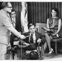 William "Bill" Jacks, a deputy probation officer with Plumas County, receives the California Handicapped Rehabilitant of the Year 1975 award. From left, Harry Towne (Rehabilitation Dept.), Mario Obledo (Secy. of Health and Welfare), and Mary Jacks