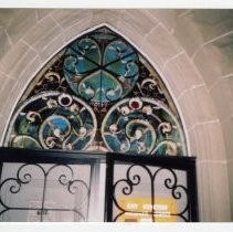 Close-up view of the stained glass window above the door of the Sacramento City Cemetery Mortuary Chapel and Archives Office on the grounds of the cemetery