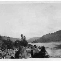 Postcard of one of the Two Sisters (north) at the mouth of the Klamath River, looking east