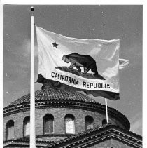 View of the clock on the Agricultural Building at the California State Fair. Clock is depicting time in reverse or "Time Was" in 1963