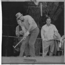 Bob Lunn, pro golfer, blasting chipping onto the green at the S.F. International Open Golf Tournament as spectators watch