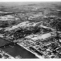 Southern Pacific Railyard, aerial view looking northeast, piles being driven for new rail depot, ca.1922