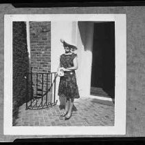 A woman standing on a brick walkway