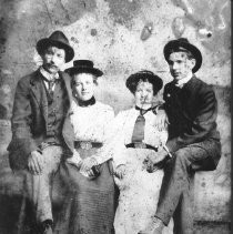 Studio portrait of four undientified people