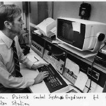 View of George William Patrick, Control System Engineer at his station for the California Resources Agency, Department of Water Resources