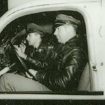 Two policemen in squad car