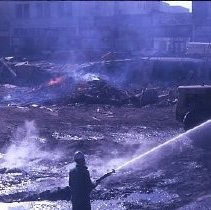 View of a fire in downtown Sacramento. Firemen are seen working on the fire