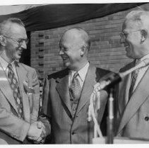 President General Dwight D. Eisenhower shakes hands with Sacramento Mayor Les Wood as Governor Early Warren looks on