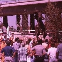 Old Sacramento. View of the Pony Express Statue site at 2nd and J Streets. View shows the site and installation of the statue. Crowd gathers during dedication