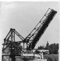 Walnut Grove Bridge-A drawbridge rises for a large cruise liner at Walnut Grove