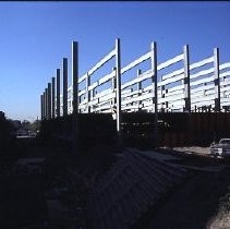 Site of the Downtown Plaza Parking Garage, Lot "G" near Macy's Department Store, 4th, 5th K and L Streets under construction. This view is looking east from the Fratt Building in Old Sacramento
