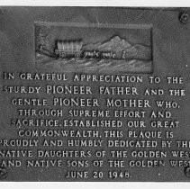 Close-up view of the bronze plaque located on the west entrance of the California State Capitol building donated by the Native Daughters and Sons of the Golden West