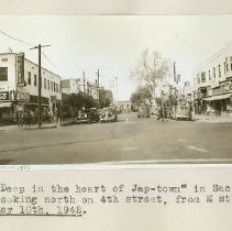 Japanese commercial district, looking north on 4th Street at M Street [Capital Mall]. Photograph taken May 10, 1942 (just before internment)