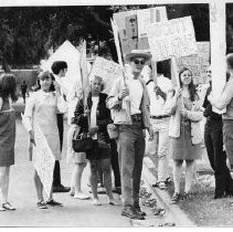 Students wait for transport to protest