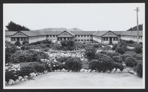 [view of barracks with gardens]