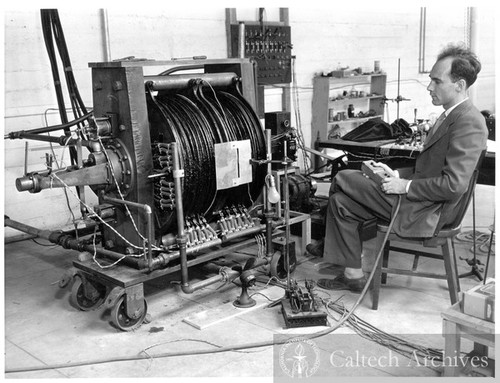 Carl Anderson with the magnet cloud chamber with which he discovered the positive electron or positron