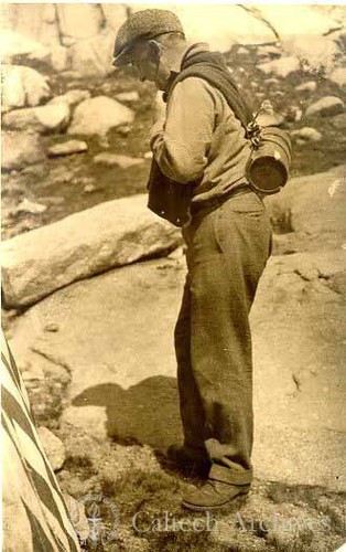 Robert Millikan carrying cosmic-ray equipment up Mt. Whitney