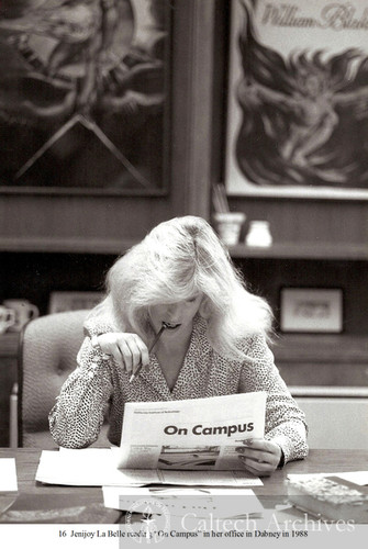 Jenijoy La Belle reading “On Campus” in her office in Dabney