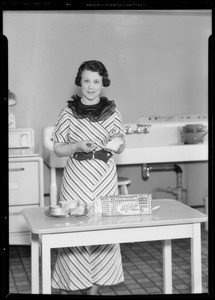 Mrs. Lockland with loaf of Weber bread, Southern California, 1935