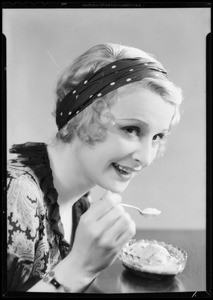 Girl eating ice cream sundae, Southern California, 1932