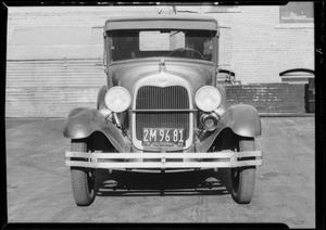 Ford coupe hit by boy on bicycle, Southern California, 1933