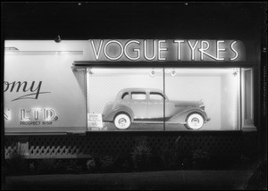 Vogue Tyre board with Dodge sedan, Southern California, 1935