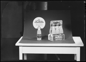 Bottle of Orange drink poster and carton, Southern California, 1940