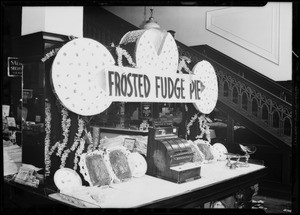 Man in window, Woolworth's, also inside display, Southern California, 1931