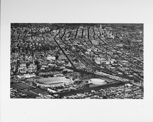 Aerial view, Exposition Park, Coliseum, Museum of Natural History, Sports Arena, looking northward into Downtown Los Angeles, City Hall, University of Southern California (USC)