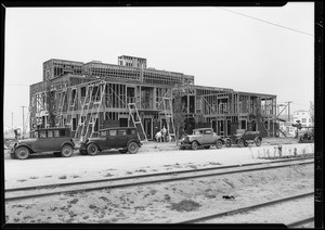 Salesmen and airplane, apartment house on Leimert Boulevard, steam shovel at work, Southern California, 1929