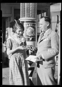 Presenting watch to girl, Tarzan contest, Signal Oil Co., Southern California, 1933