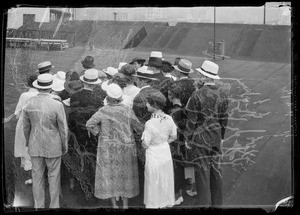 Street car and crowds for dollar day composite, Southern California, 1935