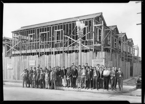 Boys inspecting frame house, Southern California, 1930