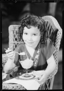 Little Cora Sue Collins and pineapple, Southern California, 1934