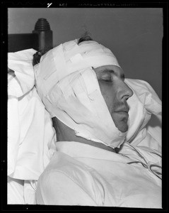 Mr. Wells in hospital bed and close-ups of bandaged head, Southern California, 1940