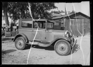 Chevrolet sedan & exterior of house, Southern California, 1935