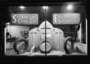 Tire window display at night, Southern California, 1927