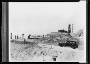 Oil truck and plane and oil field, Southern California, 1933