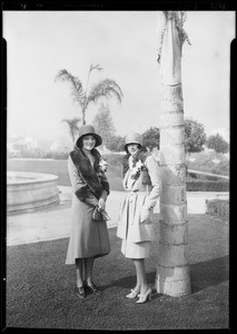 Salesmen in the Leimert Company office at 3001 West Vernon Avenue and two women posing in Leimert Park Plaza, Los Angeles, CA, 1929