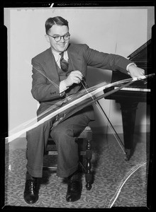 Man playing musical saws at University of Southern California, Los Angeles, CA, 1936