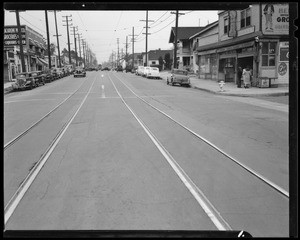 1930 Ford coupe and skid marks at North Main Street and South Avenue 21, Los Angeles, CA, 1940