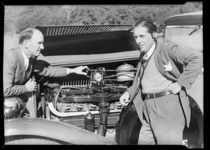 Racing drivers and microphone on car, Southern California, 1932