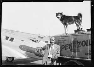 Mail plane pilot and dog, Southern California, 1931