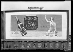 Signboard bathing girl & bottle at West Washington Boulevard & Hauser Boulevard, Los Angeles, CA, 1929