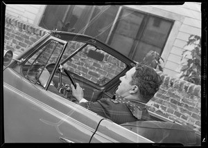 Gas measuring device in use on car, Southern California, 1940