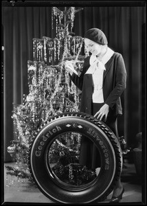 Christmas tree and tire with Lola Lane, Southern California, 1930